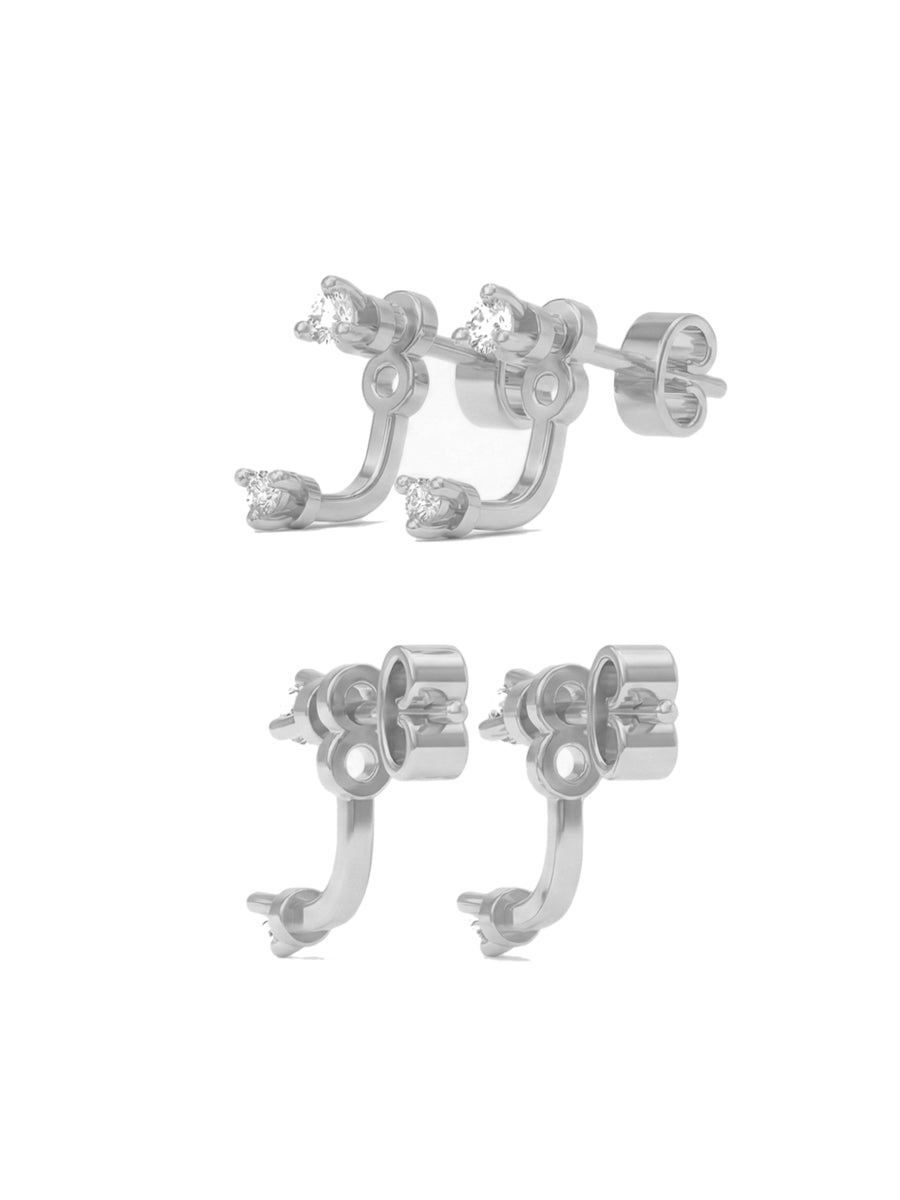 Aros Hera en plata 925 con diseño de ear jacket (aro con accesorio que cuelga tras el lóbulo) y piedras circones brillantes sobre fondo blanco.