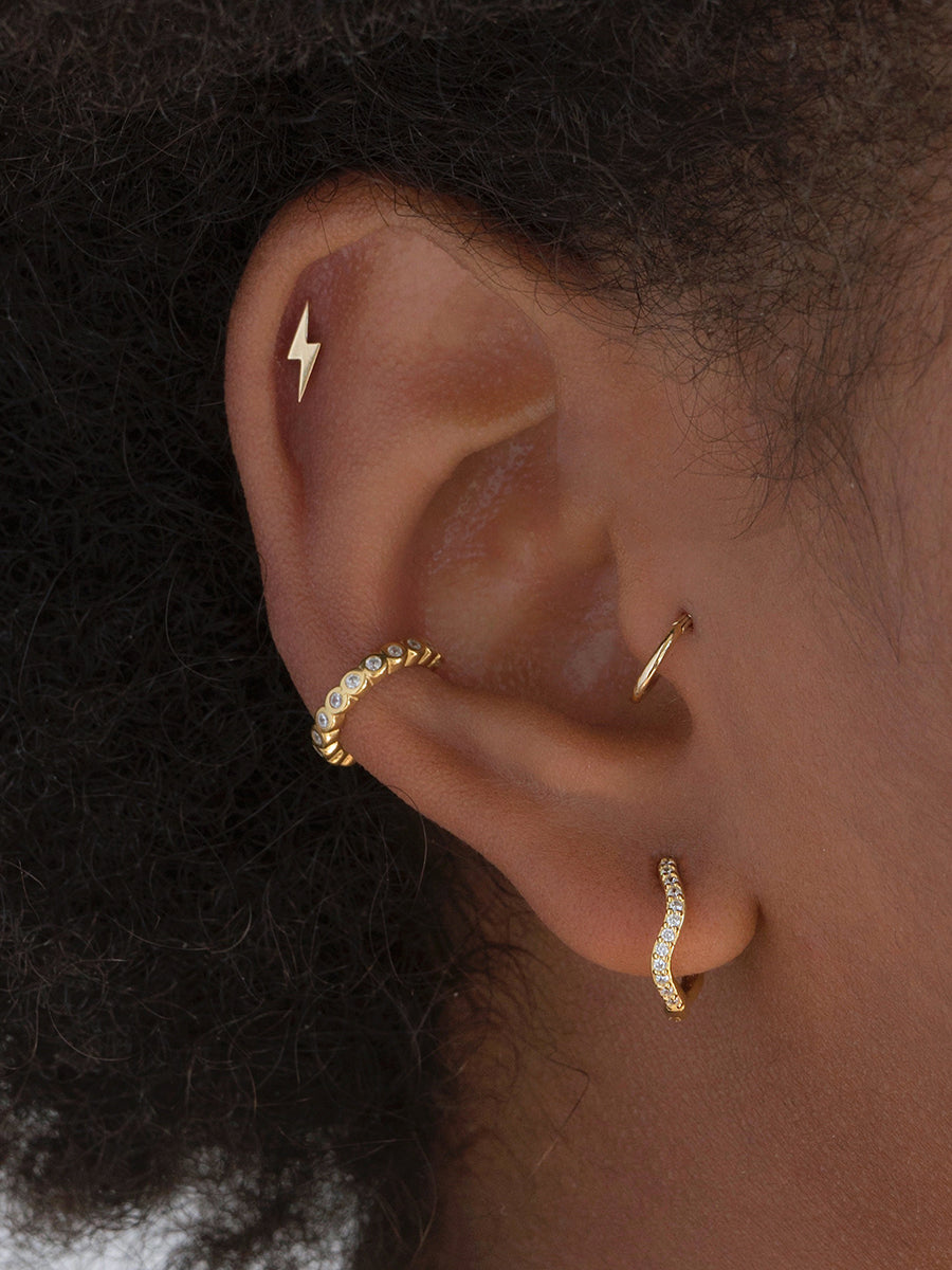 piercing para tragus helix oro amarillo clicker